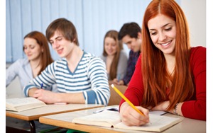 Group of students studying in classroom