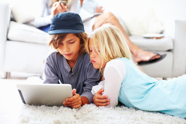 Kids on tablet pc living room