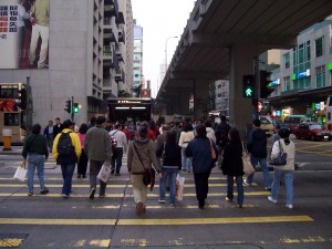 Pedestrians_cross_road_in_Mong_Kok